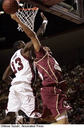Stephane Lasme cuts off Sean Marshall's path to the basket